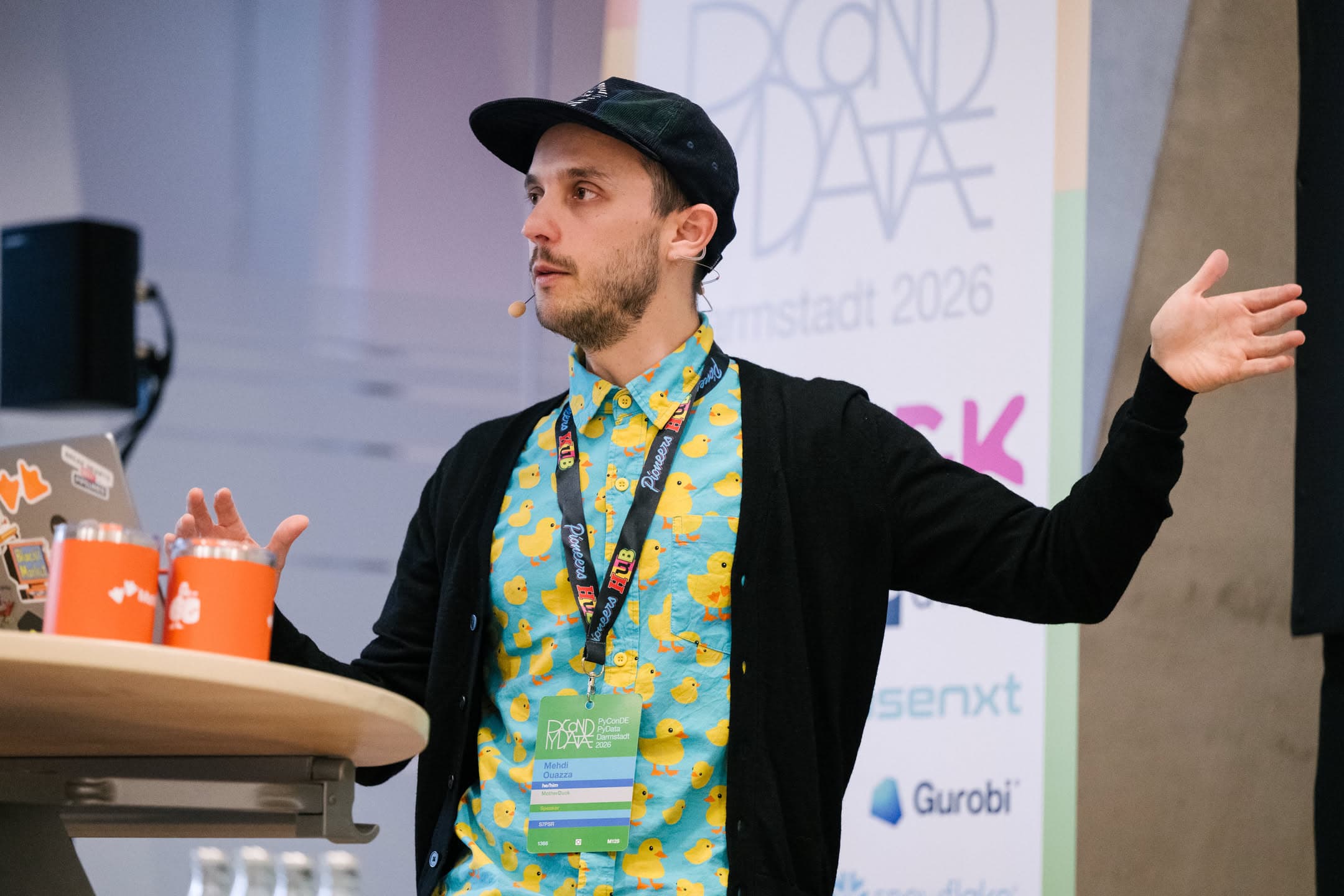 Mehdi gesturing while presenting at PyData Darmstadt